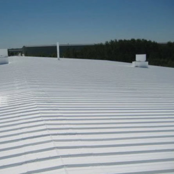 elastormeric roof coating applied to commercial building roof